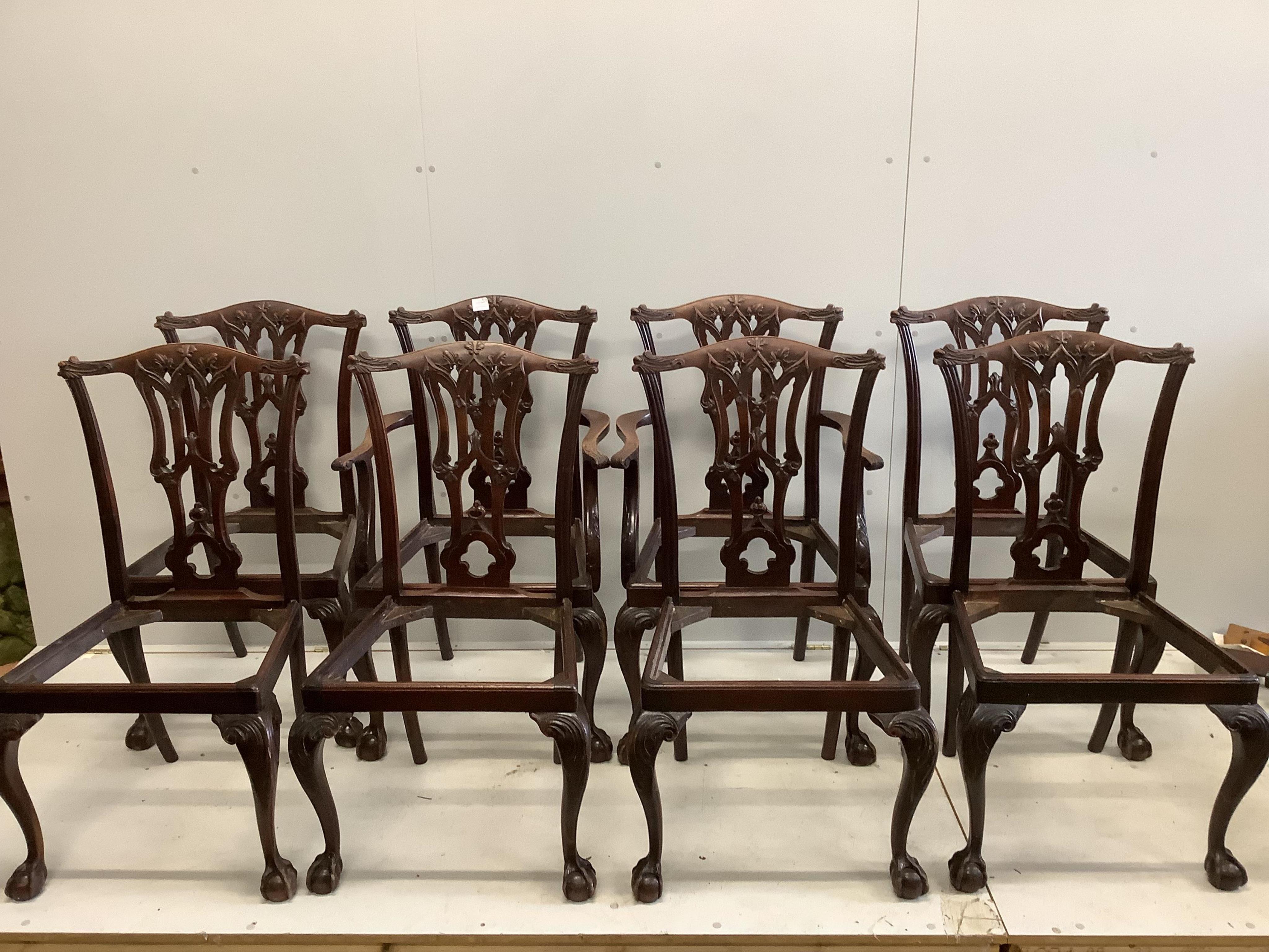 A set of eight Edwardian Chippendale style carved mahogany dining chairs (two arm, six single). Condition - faded and worn and lacking seats